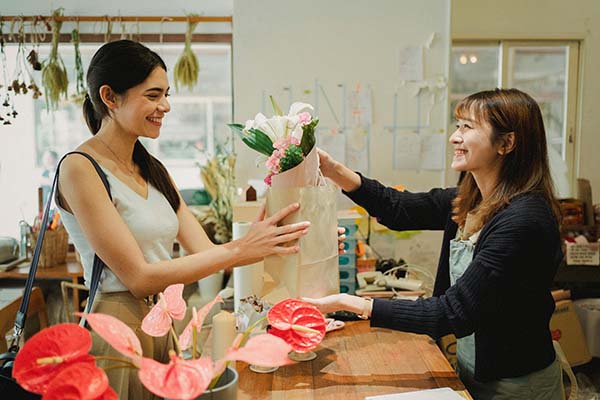 Store Owner with Customer